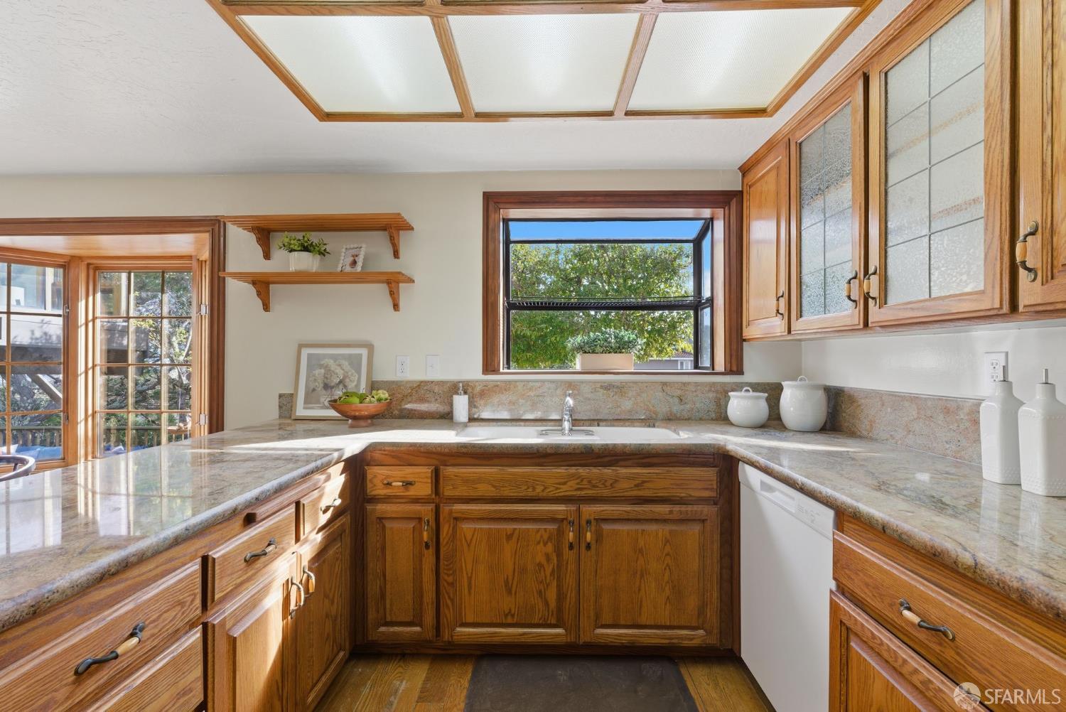969 Springfield Drive Millbrae, CA 94030 - Photo 10 of 48 a kitchen with a sink stove and cabinets