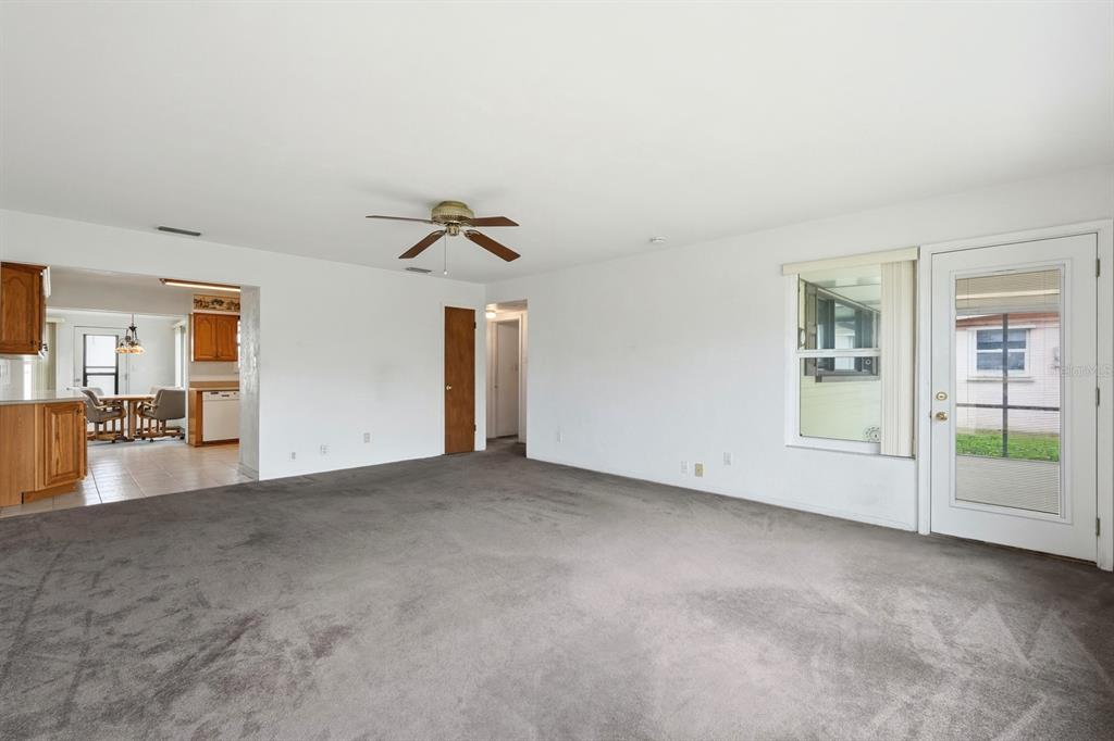 37 Berkley Road Ormond Beach, FL 32176 - Photo 12 of 41 an empty room with entrance and windows