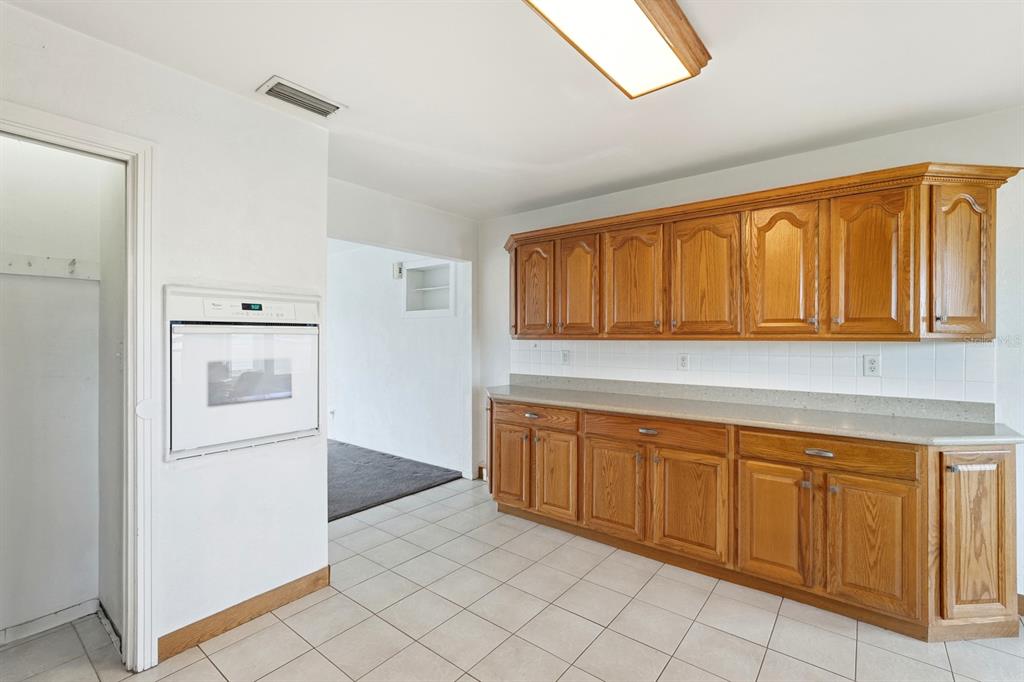 37 Berkley Road Ormond Beach, FL 32176 - Photo 13 of 41 a kitchen with a sink and cabinets