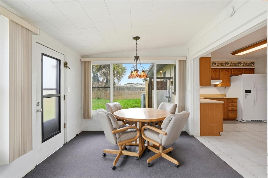 37 Berkley Road Ormond Beach, FL 32176 - Photo 17 of 41 a dining room with furniture window and wooden floor