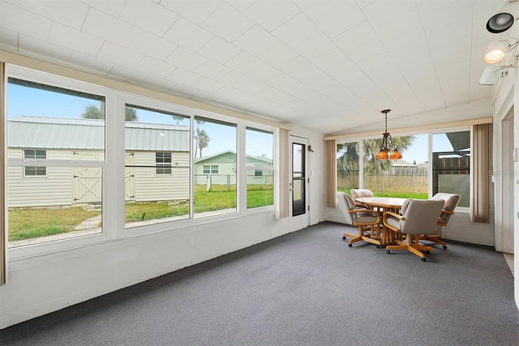 37 Berkley Road Ormond Beach, FL 32176 - Photo 18 of 41 a living room with furniture and a large window