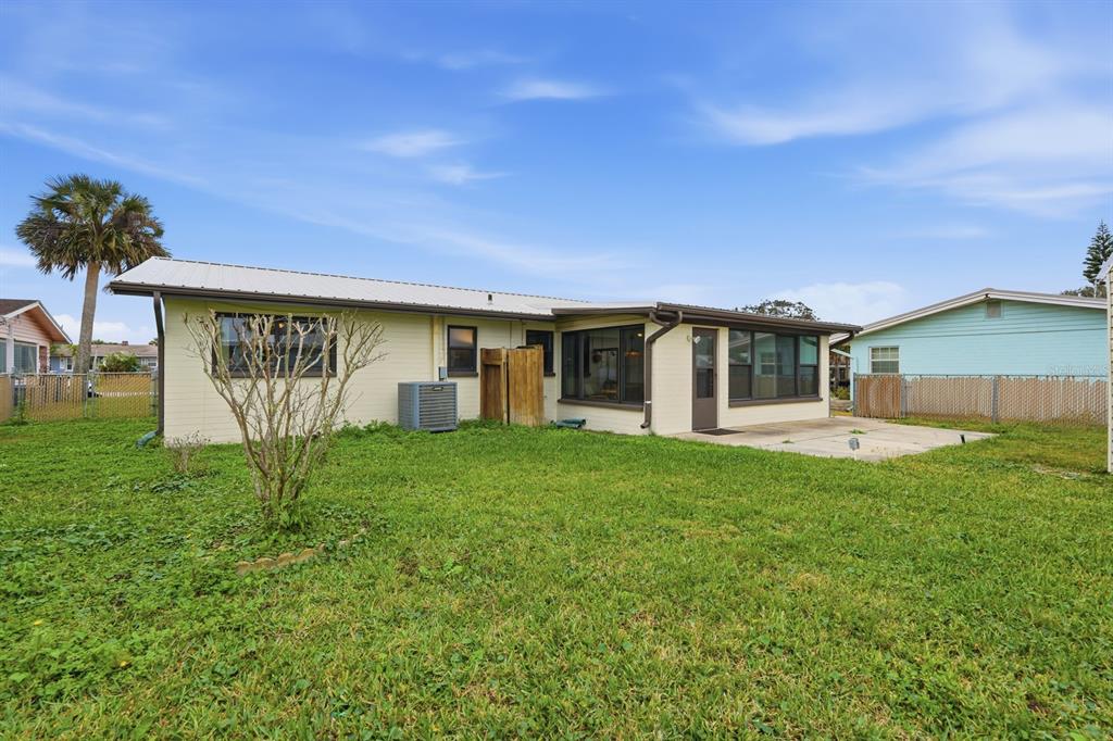 37 Berkley Road Ormond Beach, FL 32176 - Photo 24 of 41 a view of a house with backyard and a tree