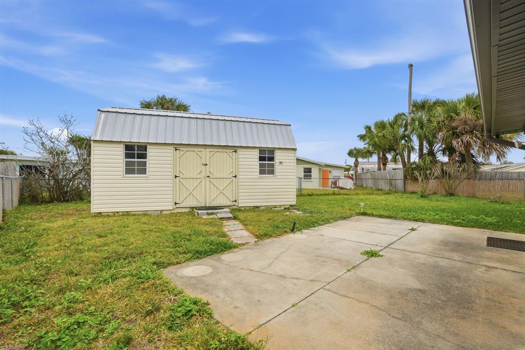 37 Berkley Road Ormond Beach, FL 32176 - Photo 27 of 41 a view of a house with a yard