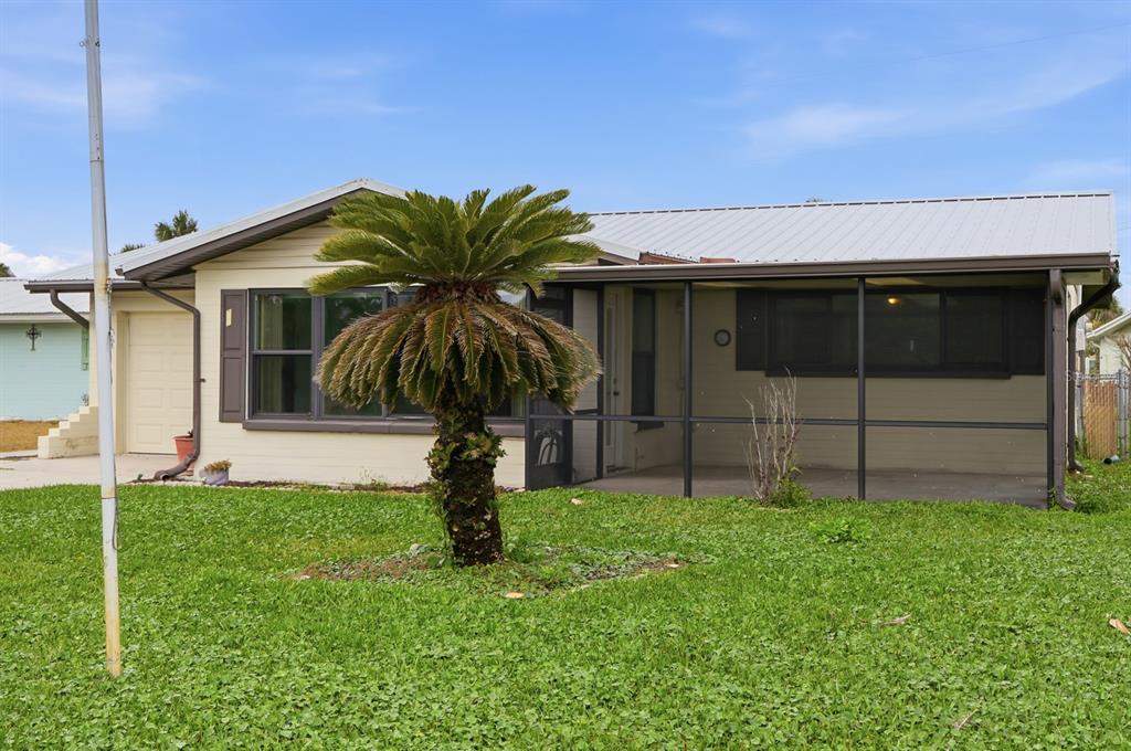 37 Berkley Road Ormond Beach, FL 32176 - Photo 3 of 41 a house with tree in front of it