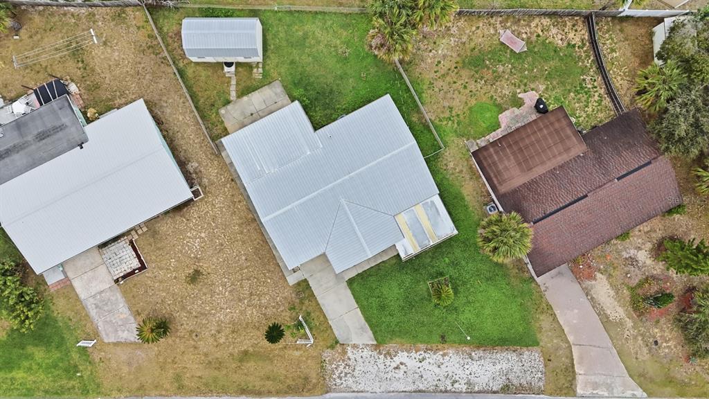 37 Berkley Road Ormond Beach, FL 32176 - Photo 32 of 41 an aerial view of a house with garden space and street view