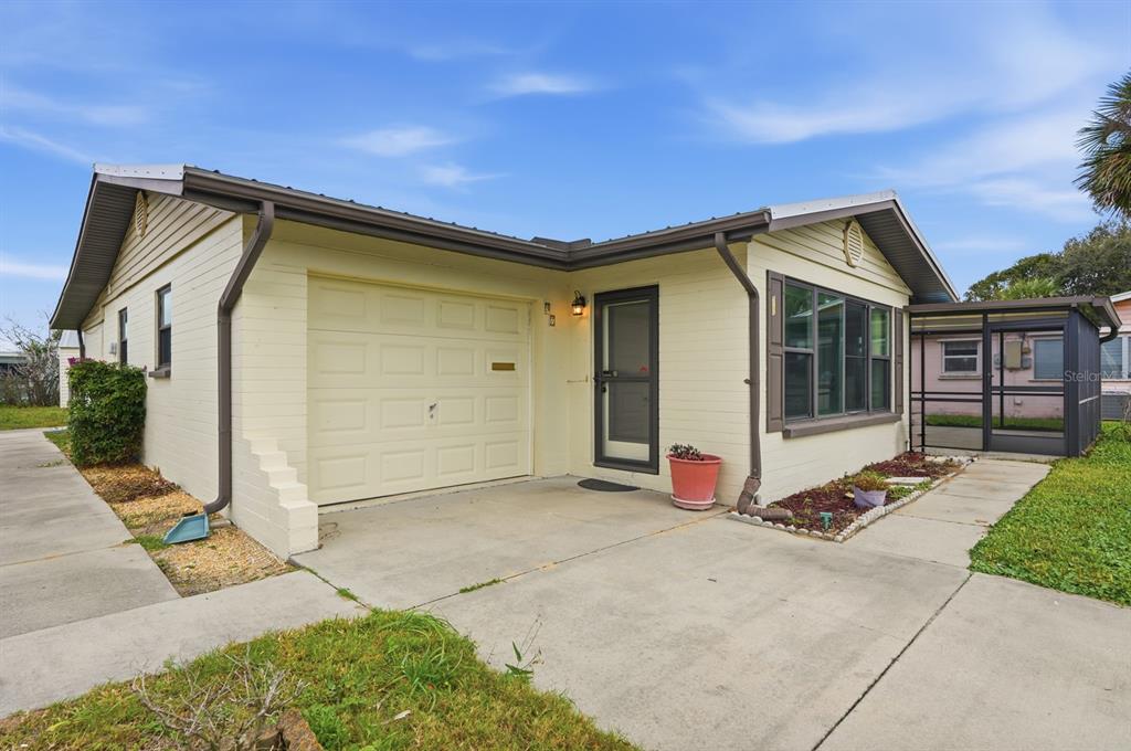 37 Berkley Road Ormond Beach, FL 32176 - Photo 7 of 41 a front view of a house with a yard
