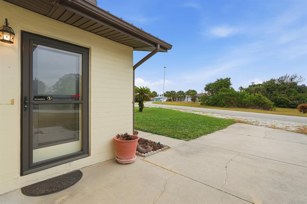 37 Berkley Road Ormond Beach, FL 32176 - Photo 8 of 41 a view of a house with backyard and porch