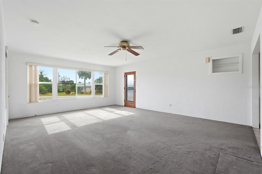 37 Berkley Road Ormond Beach, FL 32176 - Photo 10 of 41 a view of an empty room with a window