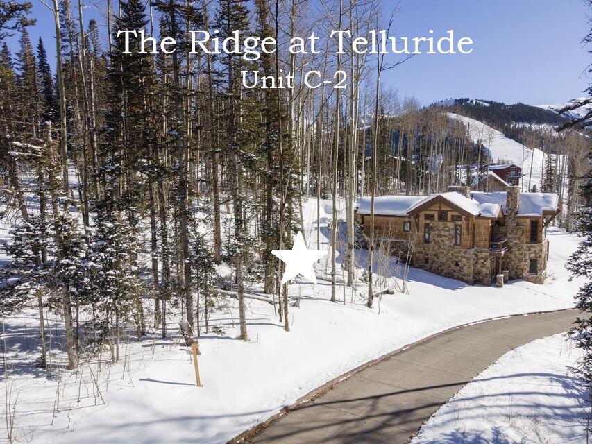 C-2 C-2 Tunnel Ln Mountain Village Telluride, CO 81435 - Photo 1 of 31 a view of tall buildings with a street
