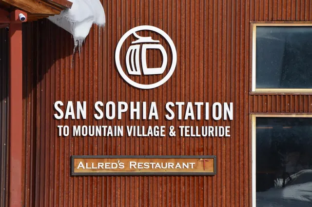 a view of a house with a snow in the background