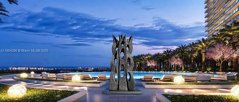 650 Northeast 32nd Street, Unit PH5201 Miami, FL 33137 - Photo 42 of 42 a view of a swimming pool with an outdoor seating and a kitchen