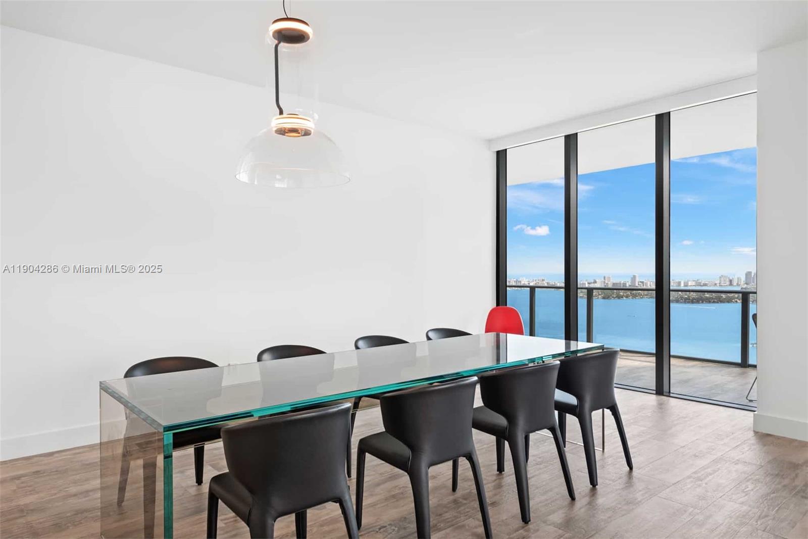 650 Northeast 32nd Street, Unit PH5201 Miami, FL 33137 - Photo 6 of 42 a dining room with furniture and window