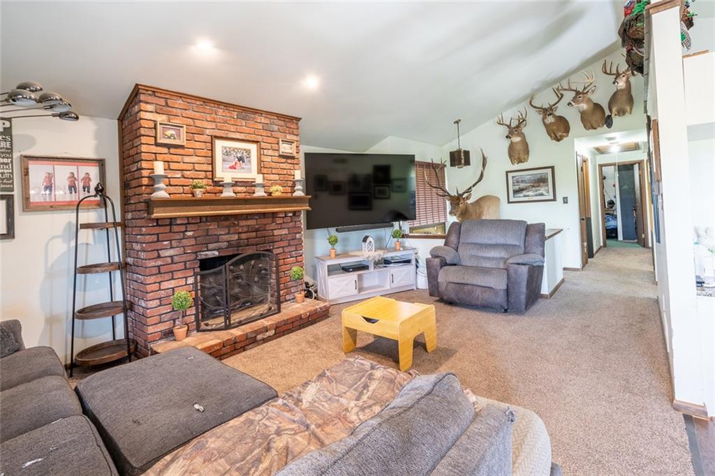 181 Hamtom Road Eighty Four, PA 15330 - Photo 15 of 42 a living room with furniture a flat screen tv and a fireplace
