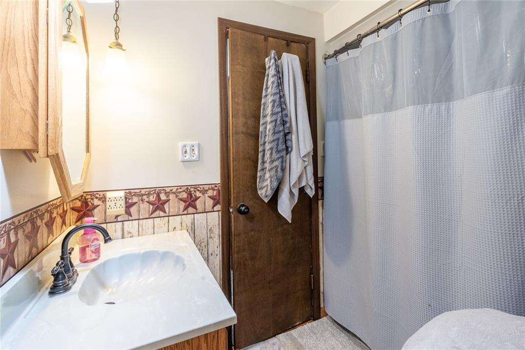 181 Hamtom Road Eighty Four, PA 15330 - Photo 21 of 42 a bathroom with a sink and a mirror