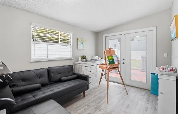 a living room with furniture and a window