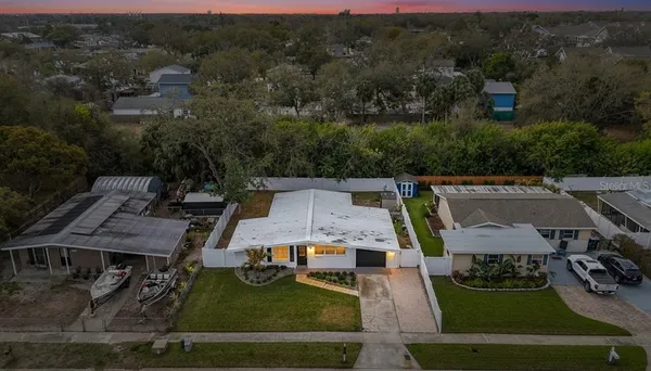 an aerial view of a house with pool
