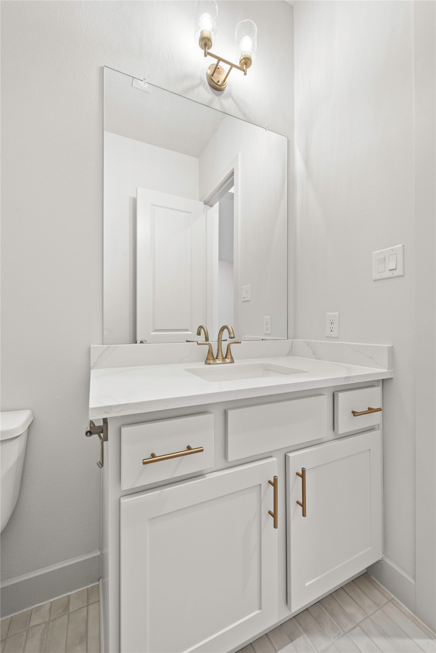 109 Meadow Beauty Lane Georgetown, TX 78633 - Photo 12 of 24 a bathroom with a sink and a mirror