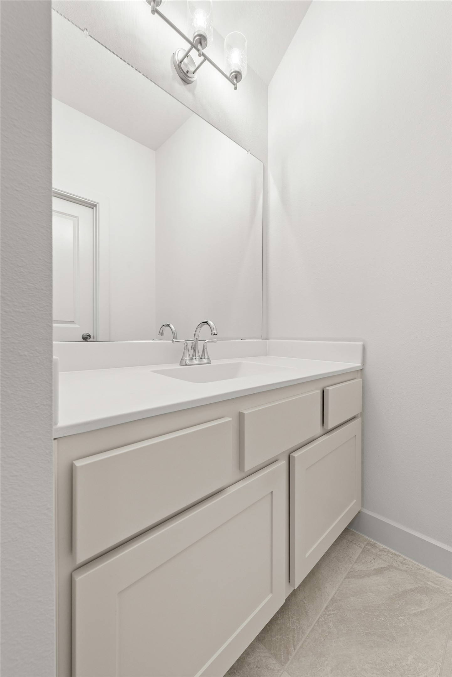 109 Meadow Beauty Lane Georgetown, TX 78633 - Photo 18 of 24 a bathroom with a sink and a mirror