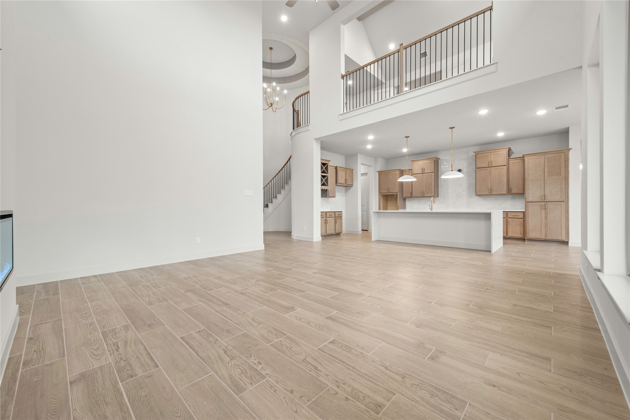 109 Meadow Beauty Lane Georgetown, TX 78633 - Photo 3 of 24 a view of large kitchen with stainless steel appliances refrigerator and microwave