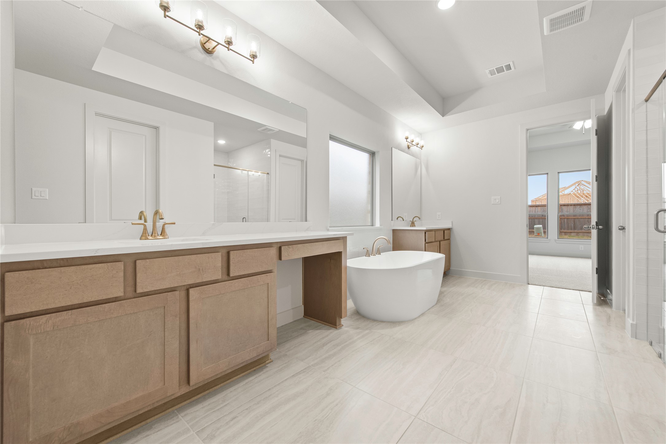 109 Meadow Beauty Lane Georgetown, TX 78633 - Photo 9 of 24 a large bathroom with a large tub sink and vanity