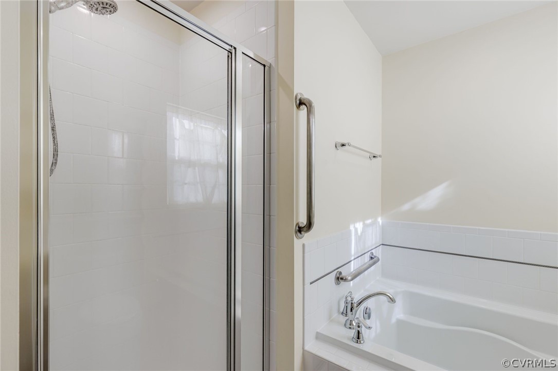 10331 Sandy Ridge Drive Chesterfield, VA 23832 - Photo 14 of 39 a bathroom with a bathtub and shower