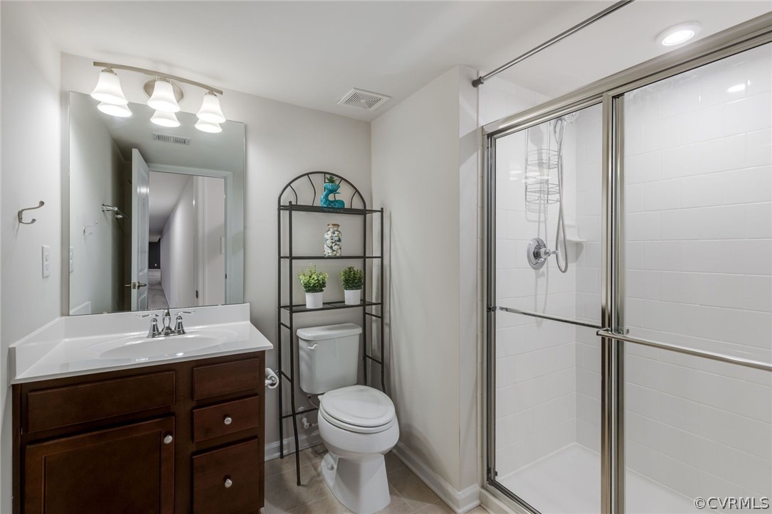 10331 Sandy Ridge Drive Chesterfield, VA 23832 - Photo 24 of 39 a bathroom with a toilet a sink and a mirror