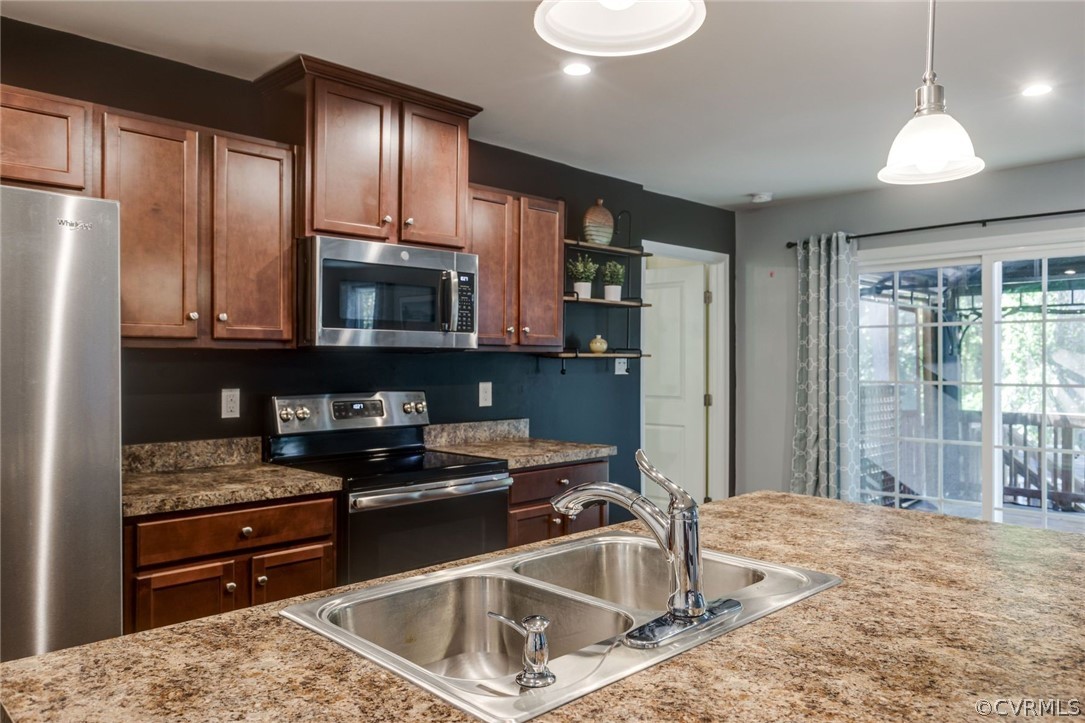 10331 Sandy Ridge Drive Chesterfield, VA 23832 - Photo 10 of 39 a kitchen that has a sink cabinets counter space and stainless steel appliances