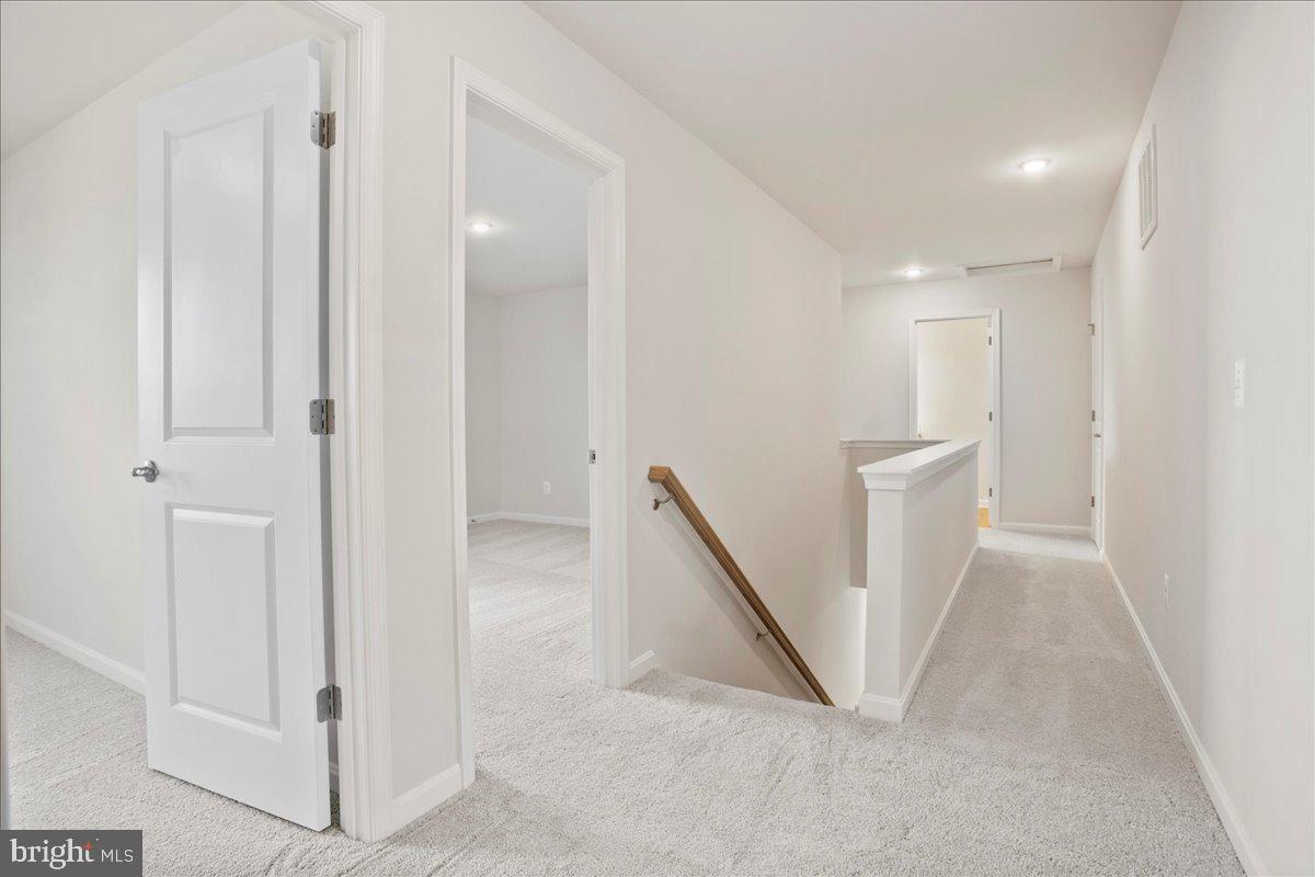 434 Freeman Street Ranson, WV 25438 - Photo 17 of 26 a view of a hallway with staircase