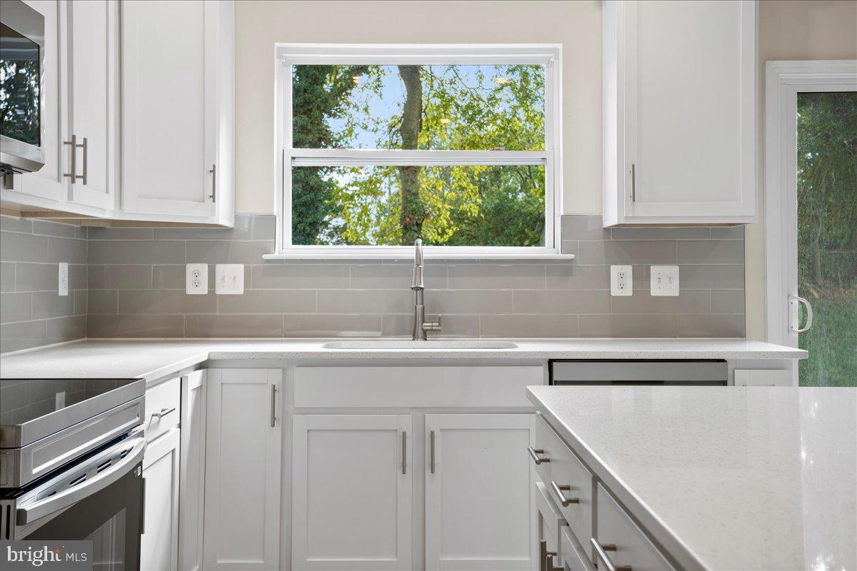 434 Freeman Street Ranson, WV 25438 - Photo 7 of 26 a kitchen with a sink and a window