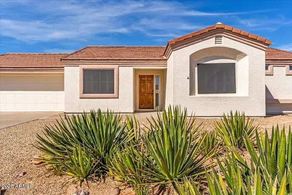 a view of a backyard of the house