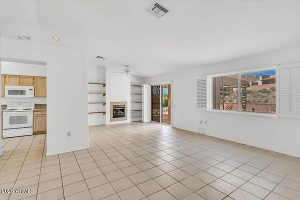 a kitchen with white cabinets and white appliances