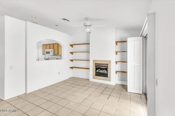 a kitchen with a sink a refrigerator and cabinets
