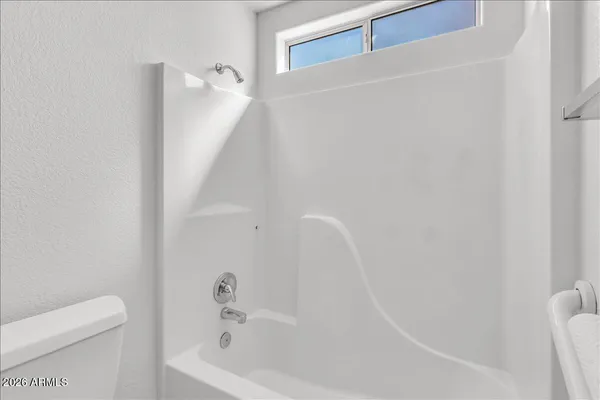 a view of a balcony with wooden floor