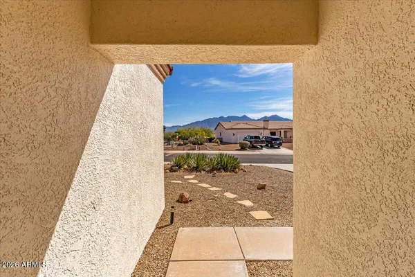 a bedroom with a bed and a view of kitchen