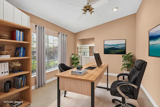 an aerial view of a house with a lake view