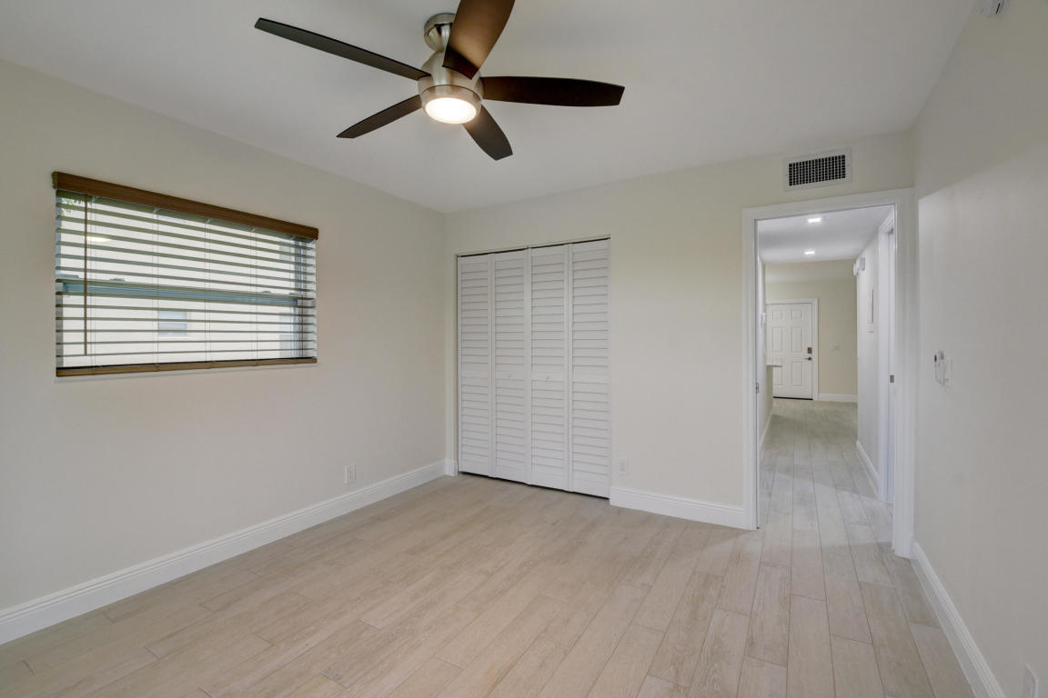 76 Flanders B Delray Beach, FL 33484 - Photo 16 of 35 a view of an empty room with a window