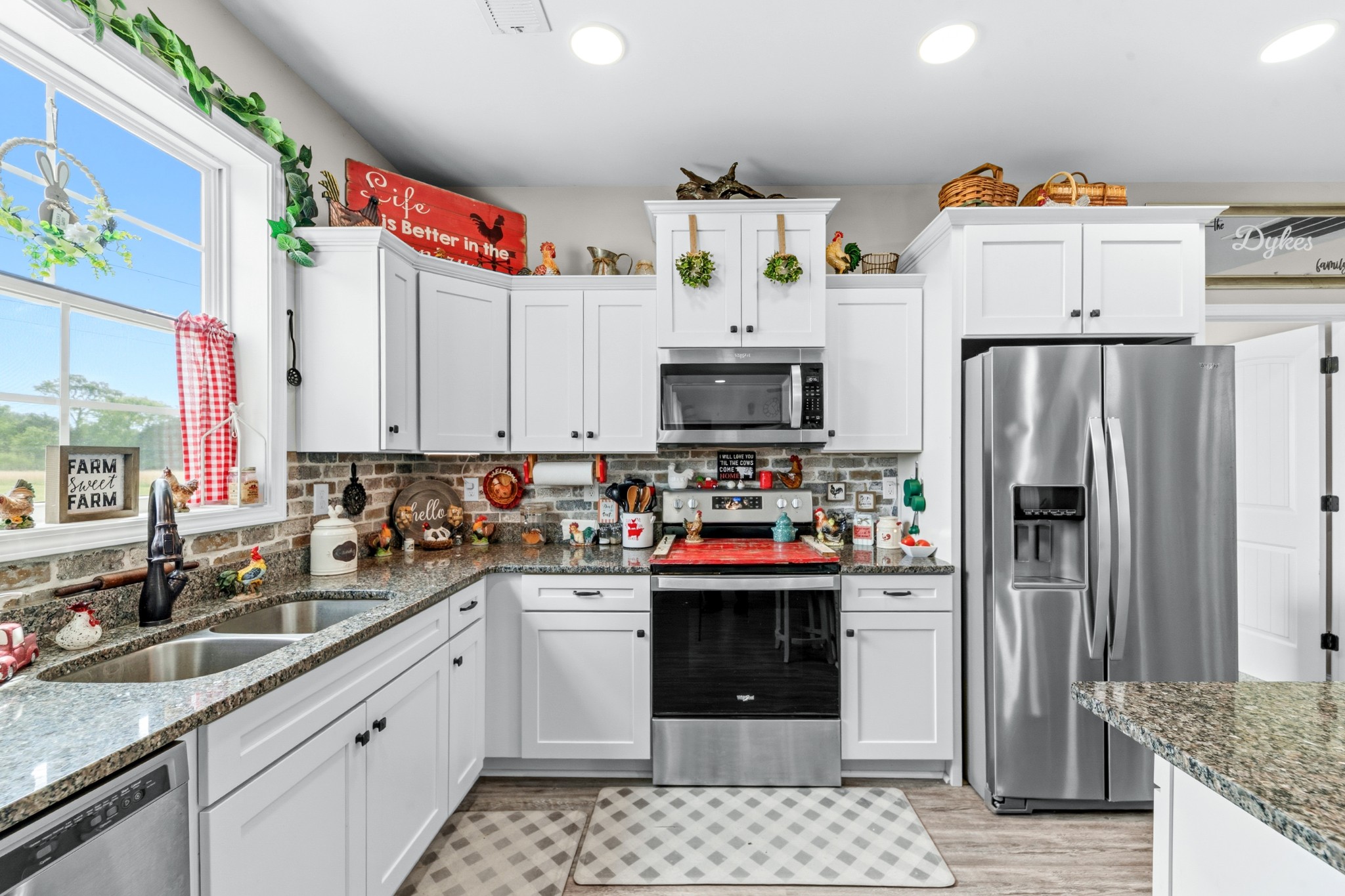 1224 Market Street Prospect, TN 38477 - Photo 20 of 80 a kitchen with granite countertop a sink stainless steel appliances and cabinets