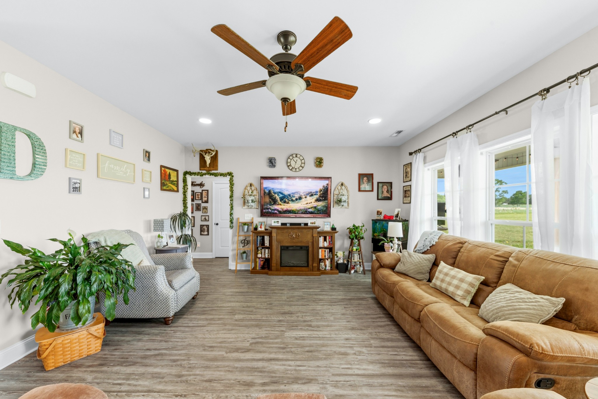 1224 Market Street Prospect, TN 38477 - Photo 26 of 80 a living room with furniture ceiling fan and a large window