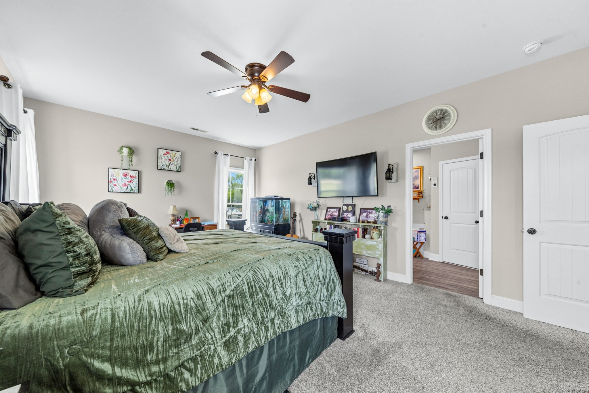 1224 Market Street Prospect, TN 38477 - Photo 32 of 80 a spacious bedroom with a bed and a chandelier