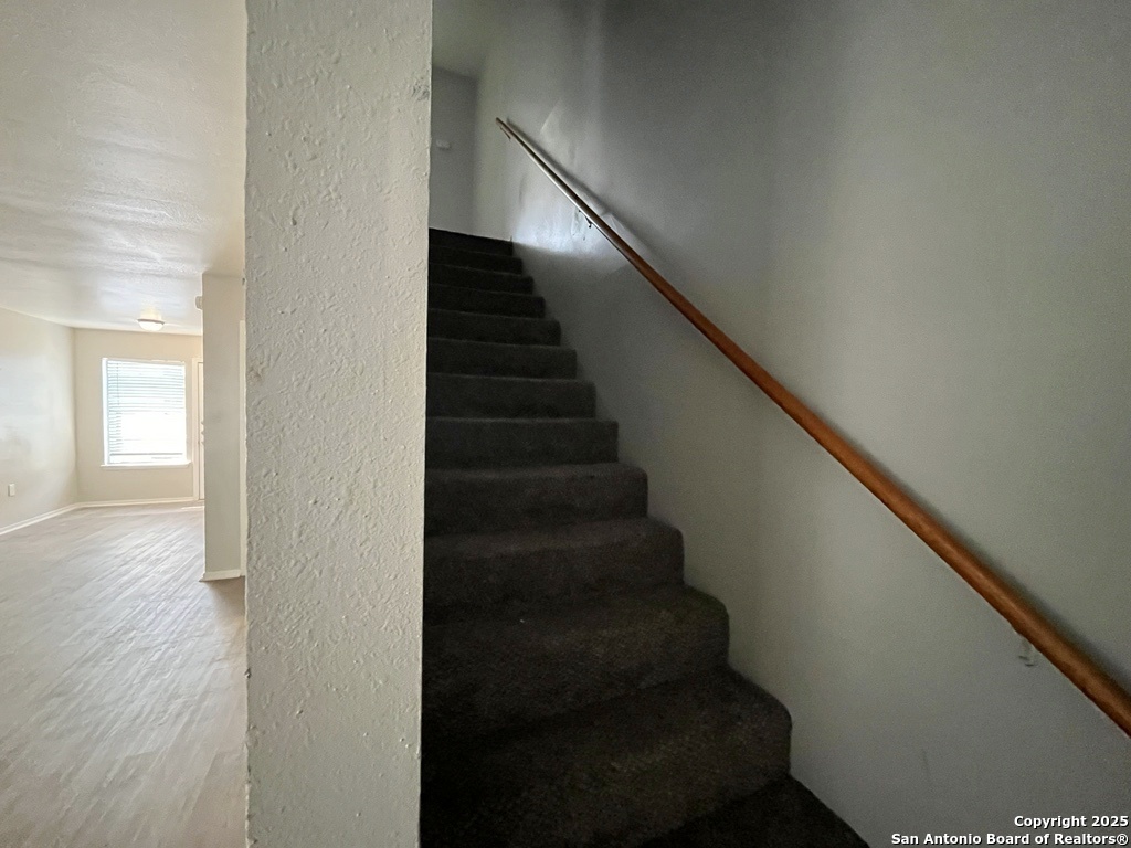 2802 Lasses Boulevard, Unit 8 San Antonio, TX 78223 - Photo 13 of 31 a view of entryway and hall with wooden floor