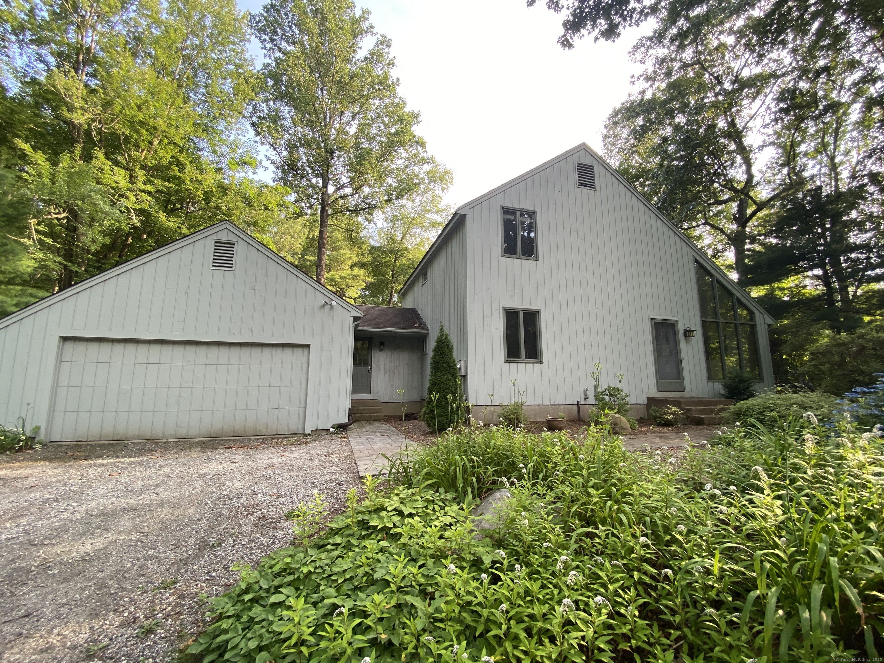 31 Weiss Road Haddam, CT 06438 - Photo 1 of 1 a backyard of a house with plants and trees