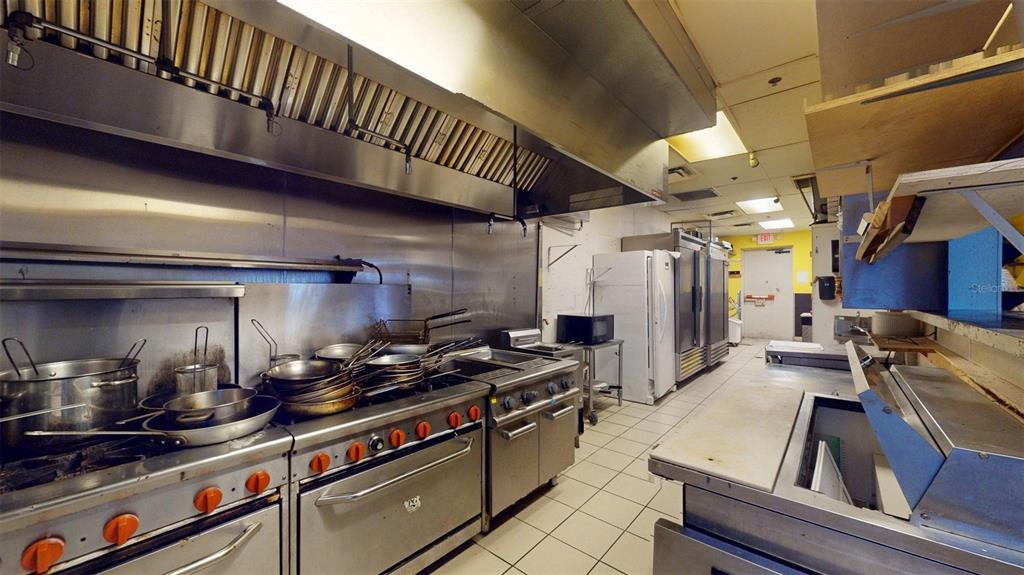 3983 Destination Drive, Unit 102 Osprey, FL 34229 - Photo 13 of 22 a kitchen with granite countertop lots of counter top space