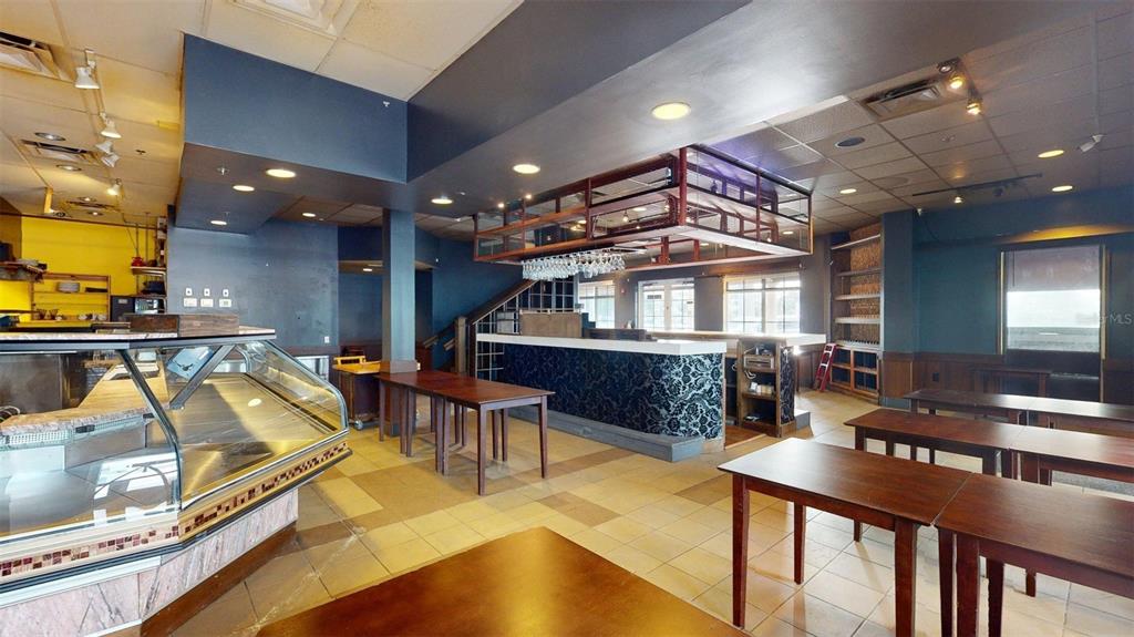 3983 Destination Drive, Unit 102 Osprey, FL 34229 - Photo 7 of 22 a view of a living room and dining room