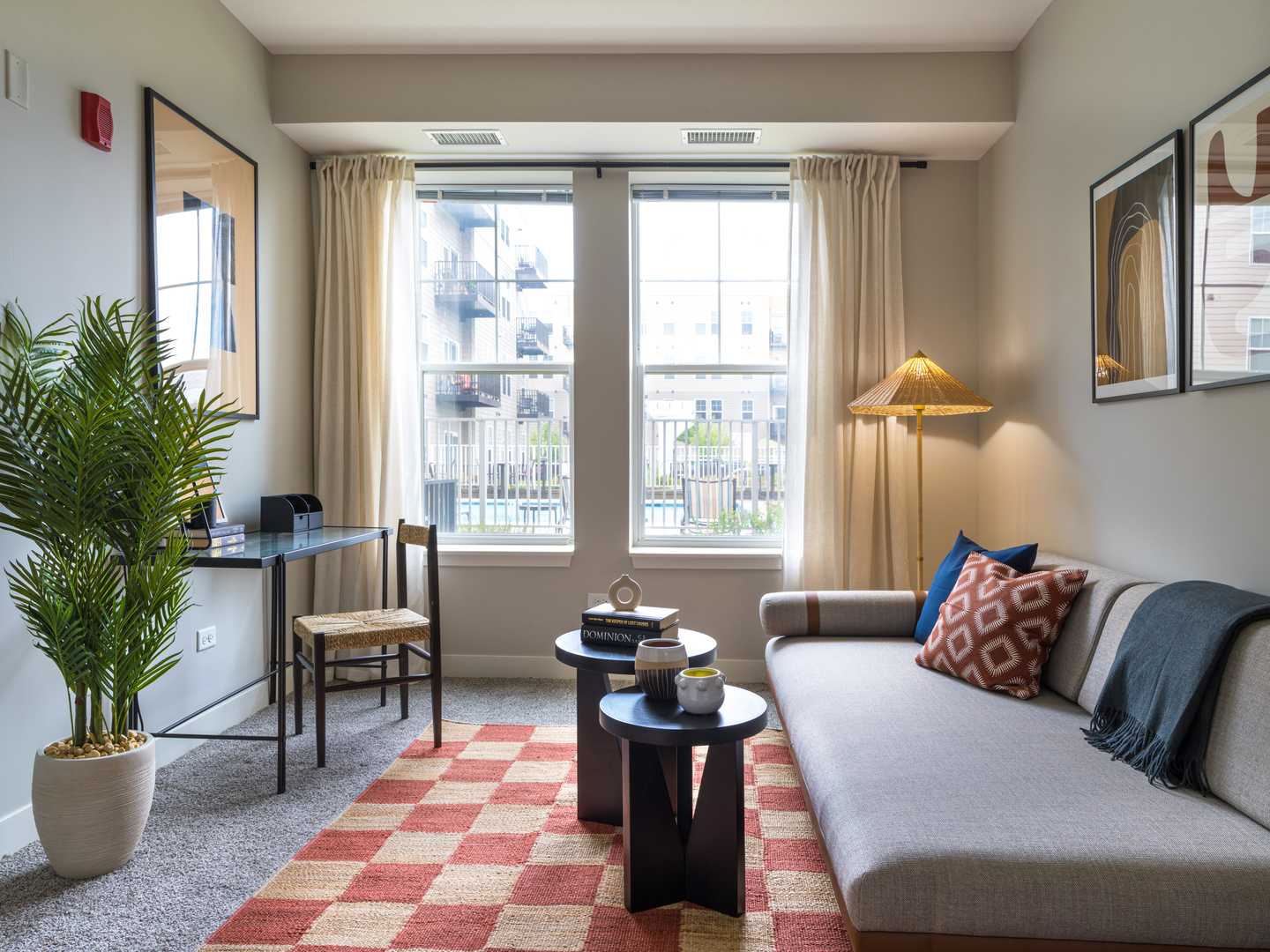 255 North Addison Avenue, Unit 338 Elmhurst, IL 60126 - Photo 7 of 20 a living room with furniture and a potted plant