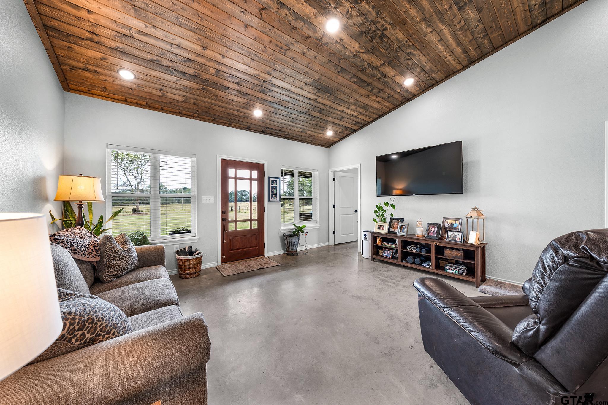 764 County Road 4315 Naples, TX 75568 - Photo 15 of 39 a living room with furniture and a flat screen tv