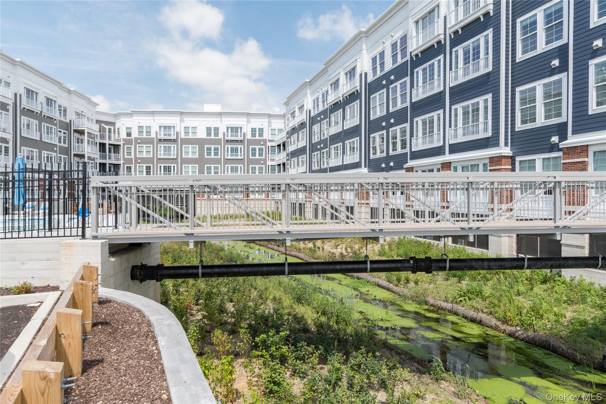 75 East Hoffman Avenue, Unit 3012 Lindenhurst, NY 11757 - Photo 6 of 8 a view of building with yard