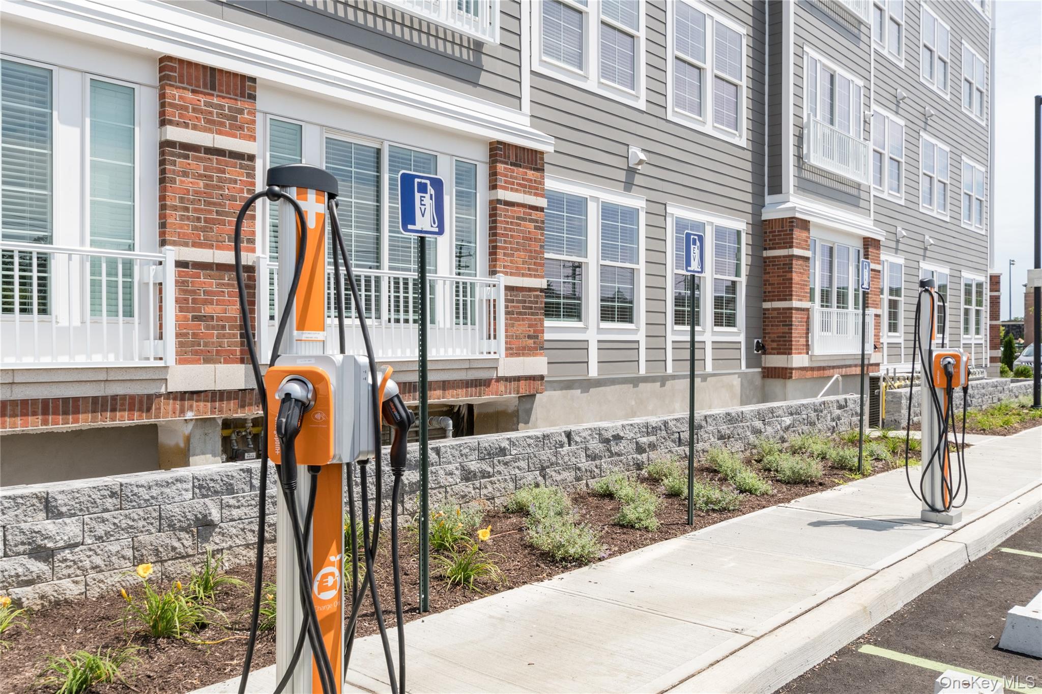 75 East Hoffman Avenue, Unit 3012 Lindenhurst, NY 11757 - Photo 7 of 8 a front view of a building with street