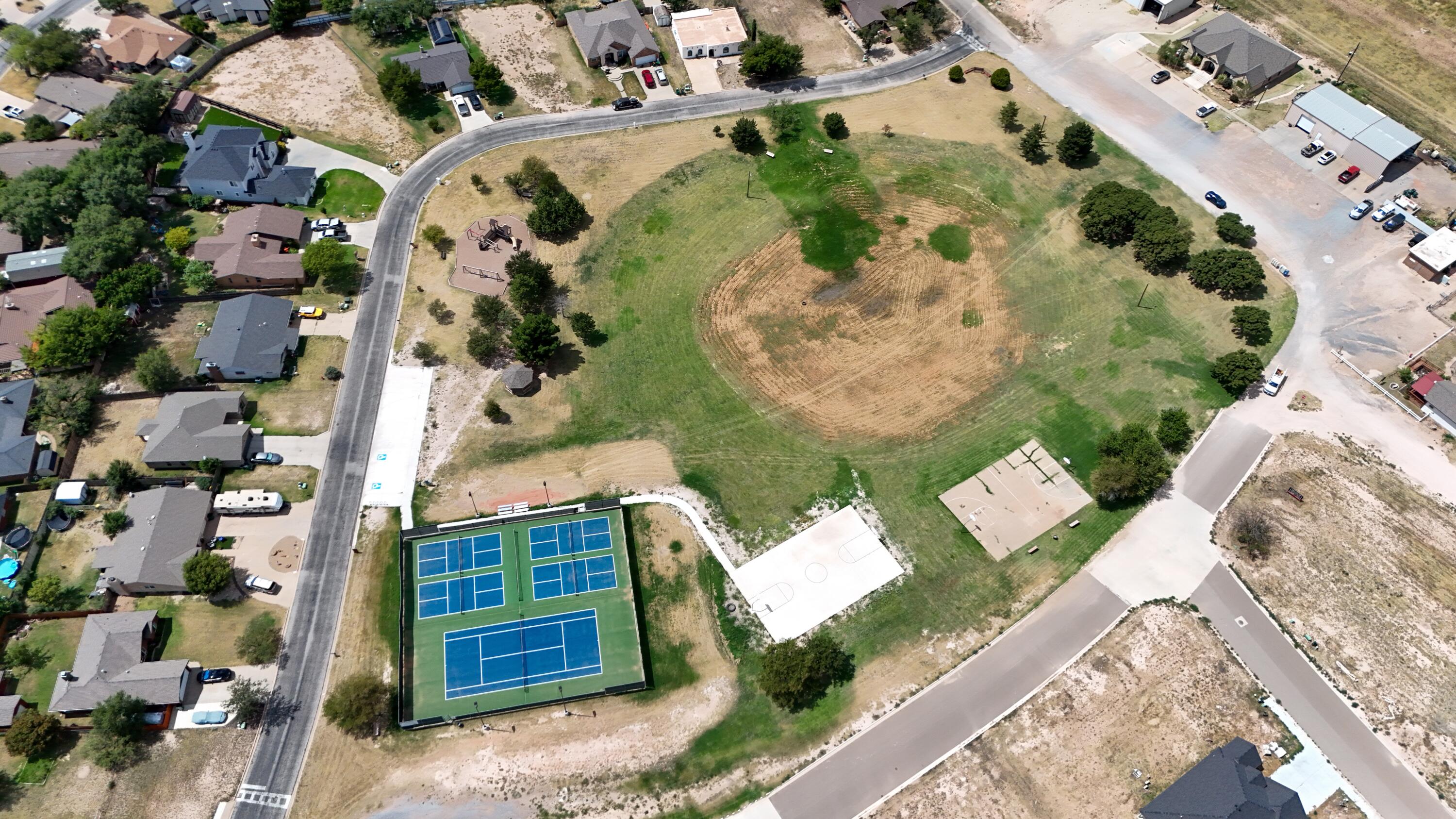 50 Parklane Drive Ransom Canyon, TX 79366 - Photo 8 of 8 an aerial view of a house with a yard and garden