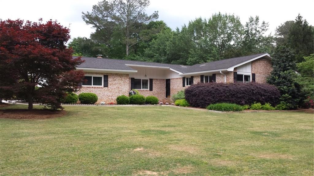 173 Rhodes Drive Southeast Marietta, GA 30068 - Photo 1 of 1 Front View on Corner Lot with side entry garage