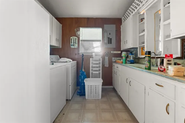 a bathroom with a sink a mirror a shower and vanity